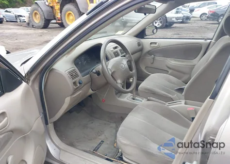 2001 Toyota Corolla Ce z USA, uszkodzony, nr VIN 2T1BR12EX1C416688